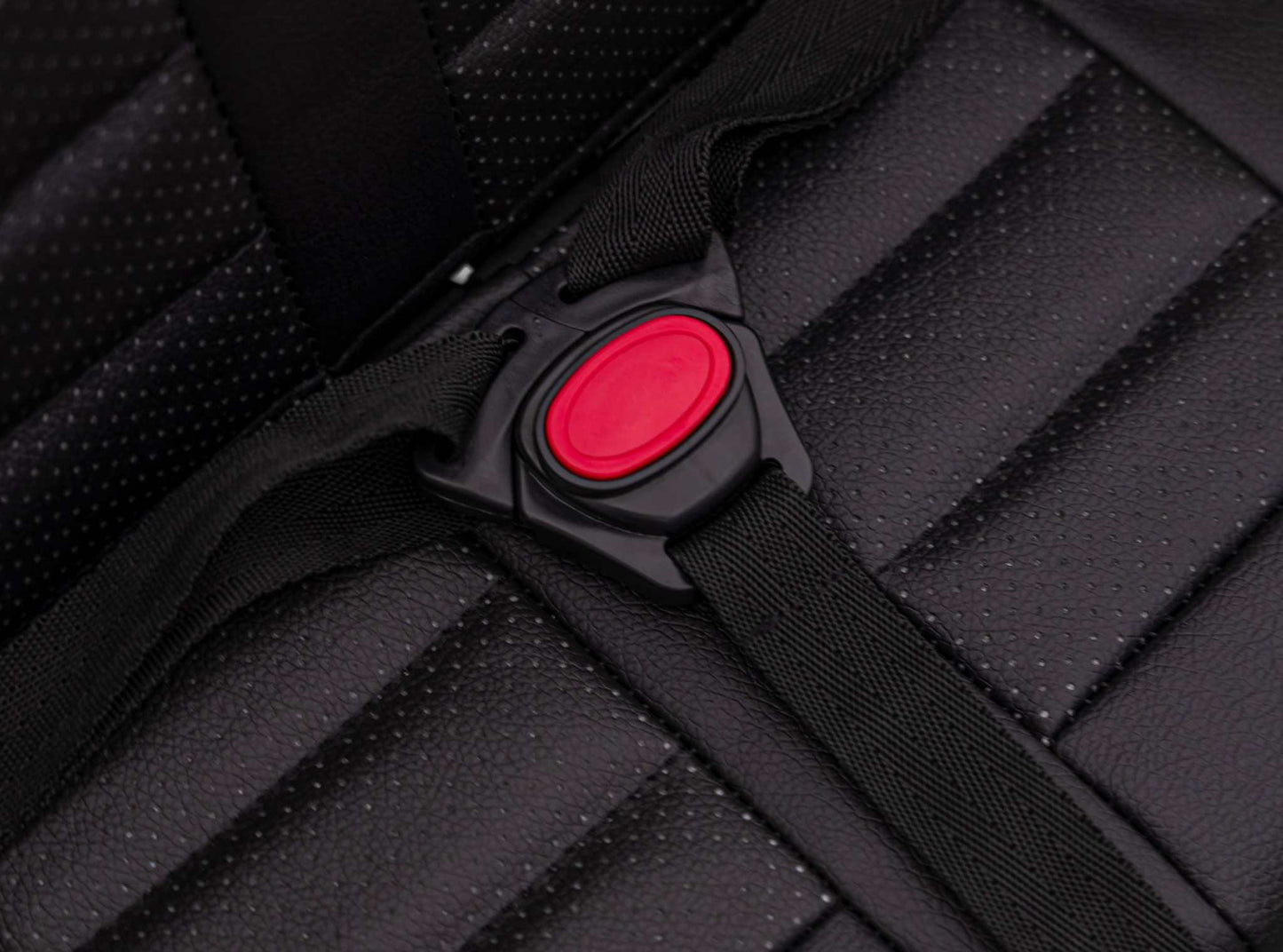 Close-up of black safety seatbelt buckle on padded seat of Toyota FJ Cruiser kids electric car