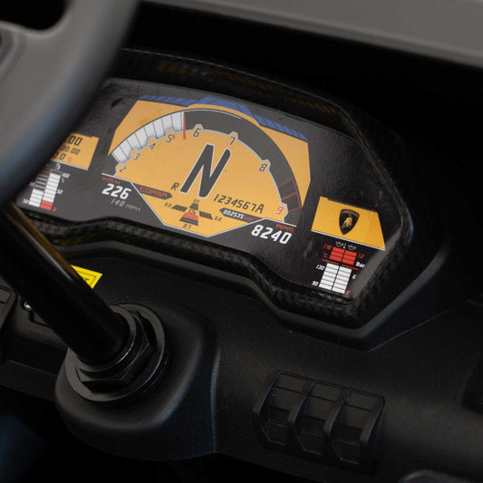 Close-up of Lamborghini Aventador SV children's electric ride-on car dashboard with digital display and control buttons