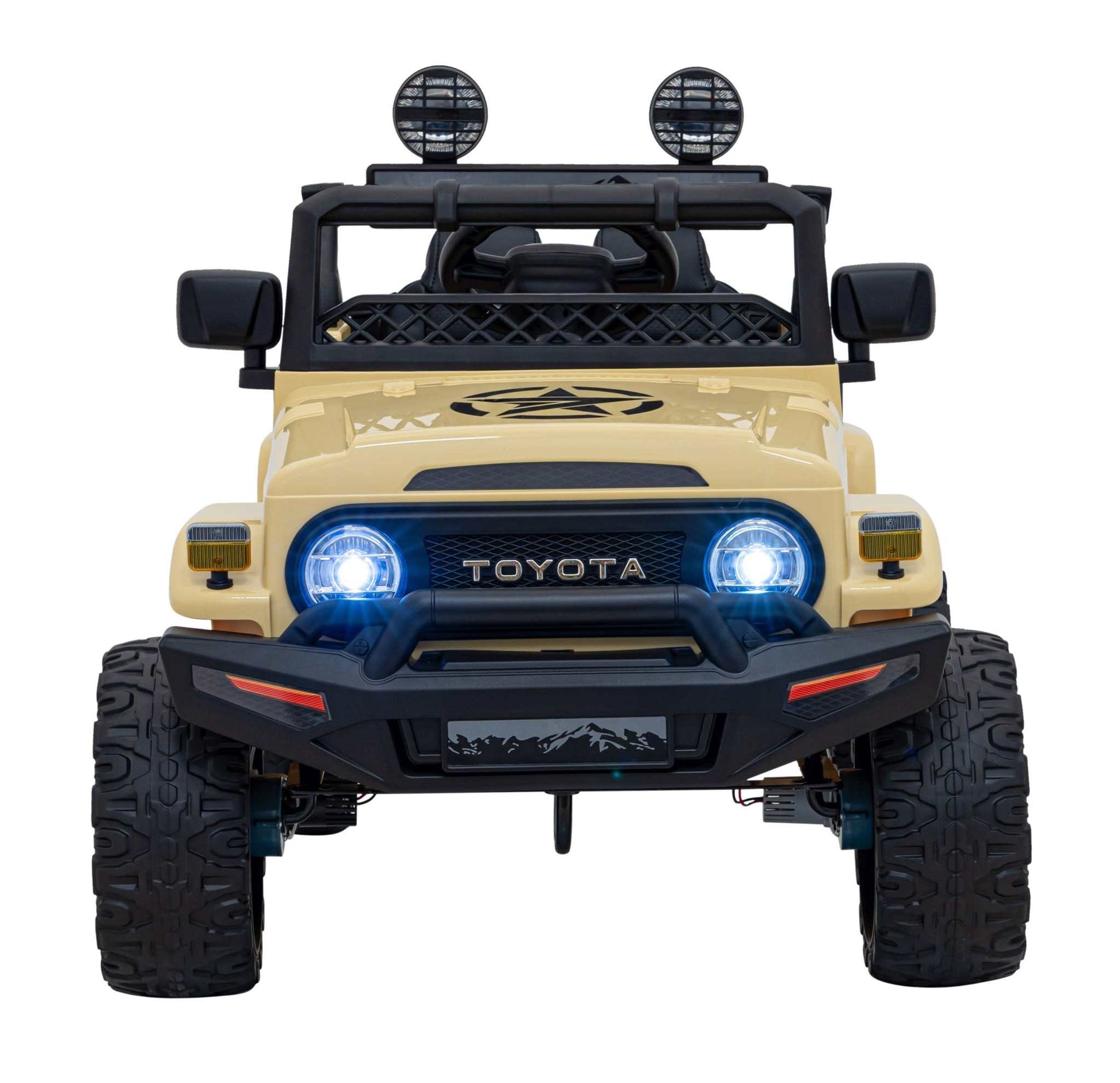 Beige Toyota FJ Cruiser kids' electric car with 4x4 drive, LED lights, audio, EVA wheels, and remote control