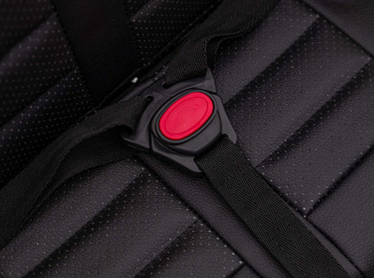 Safety harness buckle on black seat of Toyota FJ Cruiser kids electric car