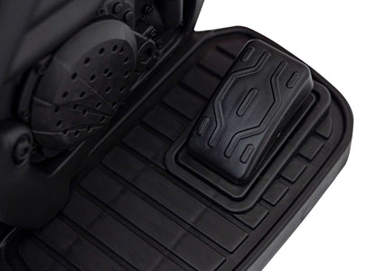 Close-up of black foot pedal on Motorek Cross Honda CRF 450R electric toy bike for kids