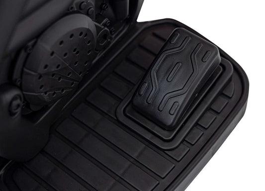 Close-up of black foot pedal on Motorek Cross Honda CRF 450R electric toy bike for kids