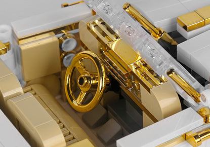 Detale wnętrza modelu samochodu Klocki Techniczne Pojazd Retro z ruchomą kierownicą i złotymi elementami