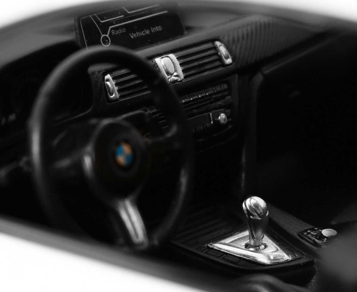BMW M4 Coupe 1:14 RC model car interior with detailed steering wheel and gear shift