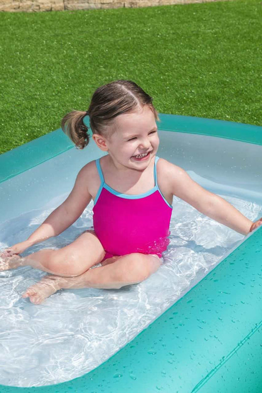 Child playing in Basen dmuchany Bestway rectangular inflatable pool with soft bottom on grass