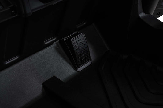 Close-up of black pedal on Buggy Madman UTV MX children's electric vehicle floorboard