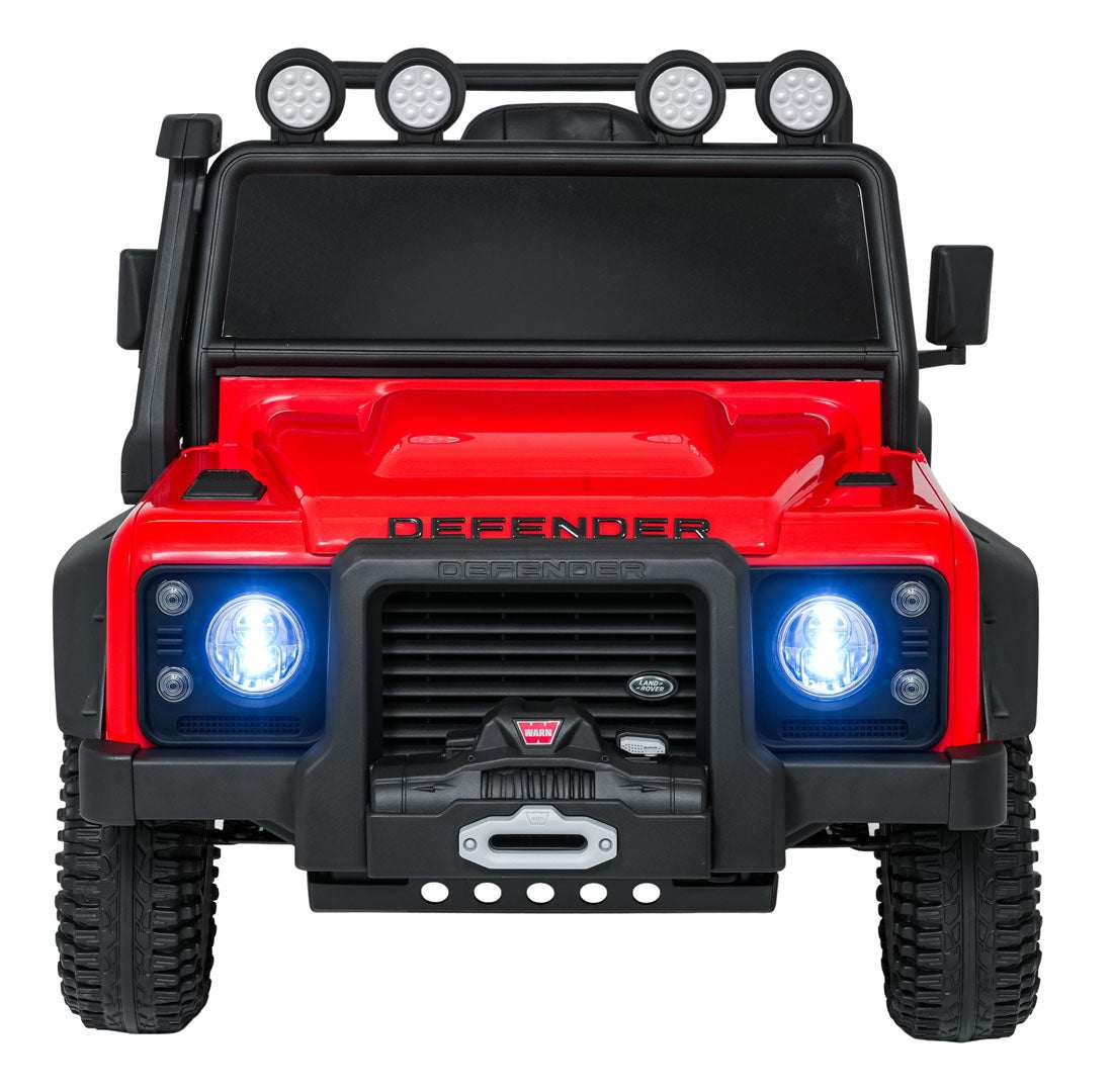Red Land Rover Defender 110 SVX electric kids ride-on car with LED headlights and off-road design